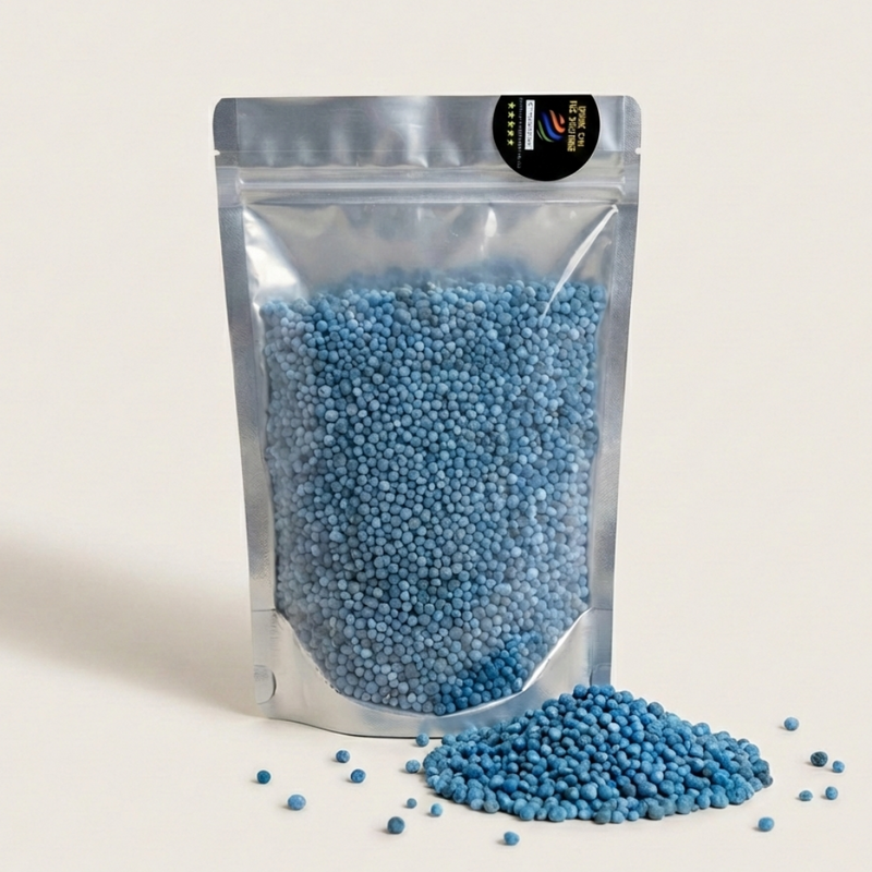 Silver stand-up pouch filled with blue beads on a beige background