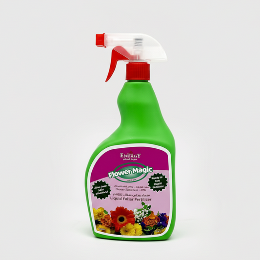 Green spray bottle with a red nozzle on a white background